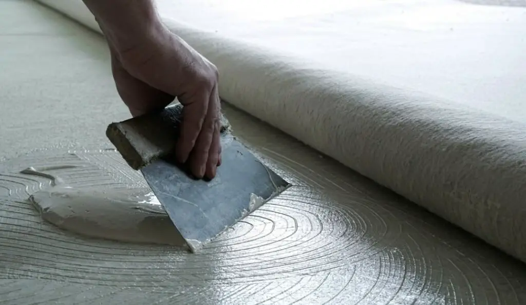 Glue carpet to concrete
