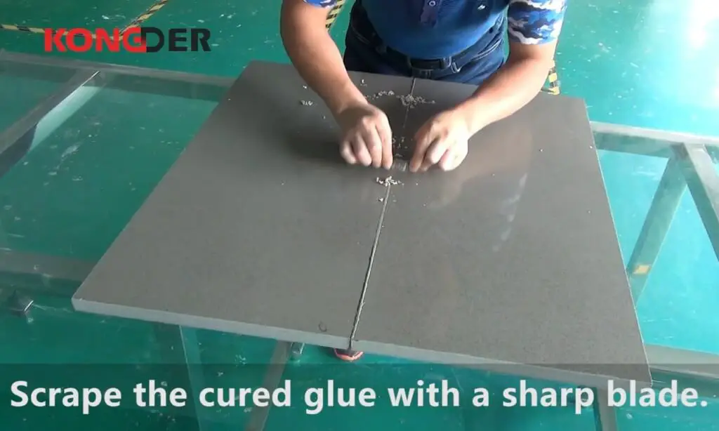Scrape the cured glue with a sharp blade