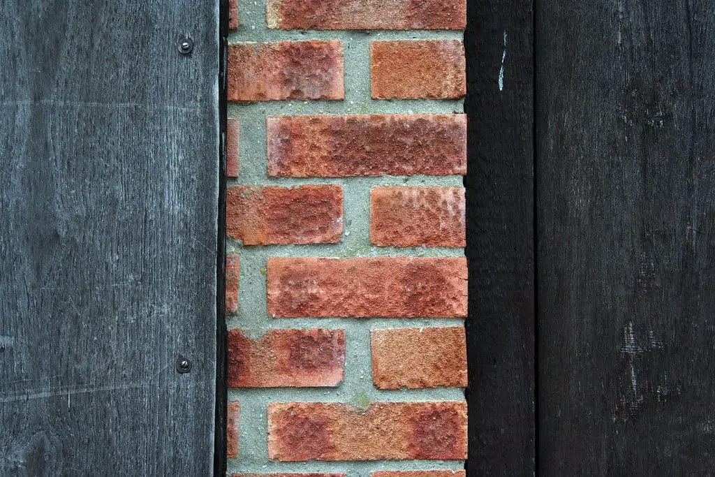 How to glue wood to brick